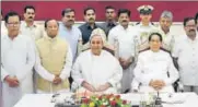  ?? ARABINDA MAHAPATRA/HT ?? Odisha CM Naveen Patnaik and Governor SC Jamir with ministers after the oathtaking ceremony on Sunday.