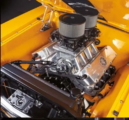  ??  ?? ENGINE BAY Nothing rhymes with orange, but billet hinges kinda rhymes with oranges. Check out the attention to detail, typified by the gloss on the firewall. This car has show-quality paint where the sun don’t shine