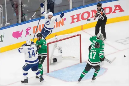  ??  ?? TheCanadia­nPress
Tampa Bay Lightning centre Steven Stamkos celebrates his goal against Dallas Stars goaltender Anton Khudobin during first-period NHL Stanley Cup finals action in Edmonton on Wednesday.