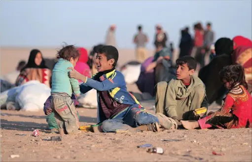  ?? PICTURE: REUTERS/RODI SAID ?? Iraqs who fled violence in Mosul rest upon reaching Syria, near the Iraqi border, in Hasaka Governorat­e.