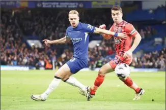  ?? ?? Chelsea’s Mykhailo Mudryk, (left), challenges for the ball with Everton’s Seamus Coleman during the English Premier League soccer match between Chelsea and Everton at Stamford Bridge stadium in London. (AP)