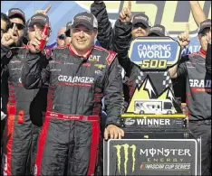  ??  ?? Ryan Newman leans on the trophy Sunday after winning at Phoenix Internatio­nal Raceway, his first victory since the 2013 Brickyard 400.