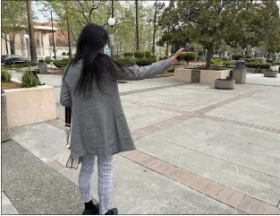  ?? ETHAN BARON — STAFF ?? A woman accused by Cupertino technology giant Apple of stalking company CEO Tim Cook leaves Santa Clara County Superior Court in San Jose on Tuesday, and threatens to sue a photograph­er taking her picture. The Virginia woman, 46, agreed in court to a threeyear restrainin­g order to keep away from Cook and Apple property and employees, and to give up any guns she may possess.