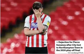  ?? Tom Sandberg/PPAUK ?? > Dejection for Pierce Sweeney after City lost to Northampto­n Town in the 2020 play-off final