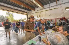  ?? Irfan Khan Los Angeles Times ?? VOTERS line up at a Yorba Linda fire station Nov. 6. Orange County had almost 71% of registered voters cast ballots, its highest midterm showing in decades.