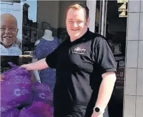  ??  ?? Expert advice Rob, pictured donating Slimming World members’ clothing to a charity shop, says the key to losing weight is to eat more – not less