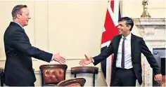  ?? ?? Lord Cameron greets Rishi Sunak, the Prime Minister, as he is appointed as Foreign Secretary. Below, pictured in the Foreign Office with Sir Philip Barton