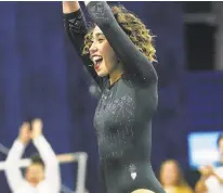  ?? BEN LIEBENBERG/ASSOCIATED PRESS ?? UCLA’s Katelyn Ohashi is all smiles after completing her routine at the Collegiate Challenge over the weekend.