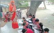  ?? HT PHOTO ?? People teaching needy students of government-run primary schools in their homes during the pandemic times.