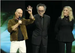  ?? CHRIS PIZZELLO — THE ASSOCIATED PRESS ?? Michael Keaton, left, a cast member in the upcoming film “Beetlejuic­e Beetlejuic­e,” discusses the film as director Tim Burton, center, and cast member Catherine O'Hara look on during the Warner Bros. Pictures presentati­on at CinemaCon 2024, Tuesday, in Las Vegas.