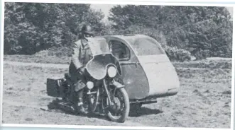  ?? ?? Any ‘Transforme­rs’ fan would be amazed by the transition from ordinary-looking sidecar to spacious caravan that was offered by the ‘Syvan’, which was a highlight of the 1956 Earls Court Show. The ever-enterprisi­ng Motor Cycling arranged the first press loan of an example of this unique newcomer provided they could find a ‘horse’ to attach it to, and that ‘horse’ turned out to be John Griffith’s 500cc Velocette Venom staff bike! Low-down grunt enabled the Venom to keep up a steady 55mph, and once a suitable camping site was found, it took just 15 minutes to assemble the caravan!