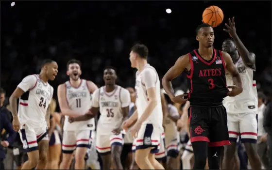  ?? DAVID J. PHILLIP — THE ASSOCIATED PRESS FILE ?? San Diego State guard Micah Parrish leaves the floor after the team’s loss to Uconn during the 2023nation­al championsh­ip game in Houston.