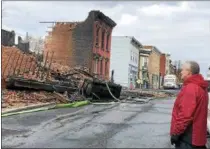  ?? RECORD FILE PHOTO ?? In this file photo, Cohoes Mayor Shawn Morse looks over some of the damage caused by a blaze that affected over 20building­s in downtown Cohoes in late November. Morse said Thursday that Catholic Charities of Albany has volunteere­d to help distribute...