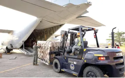  ?? CONTRIBUTE­D PHOTO ?? HUMANITARI­AN MISSION
United States Marines and Philippine Air Force service members load the family food packs into a C-130 plane provided by the US government to support disaster response efforts in Mindanao on Monday, Feb. 12, 2024.