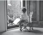  ?? SARAH WILSON ?? Marilyn Maitland, 72, reads a Care Bears book to her 4-year-old grandson, Theo.