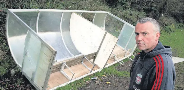  ??  ?? Menai Bridge tigers chairman Richard Fairhead and the damaged dugouts.