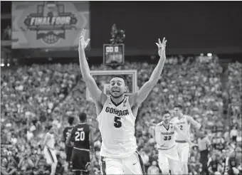  ?? CHARLIE NEIBERGALL/AP PHOTO ?? Gonzaga’s Nigel Williams-Goss (5) celebrates after the Bulldogs defeated South Carolina 77-73 on Saturday night in the NCAA tournament national semifinals in Glendale, Ariz.