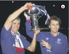  ??  ?? 5 With Graeme Roberts after his best Rangers moment – winning the 1988 Skol Cup final.
5