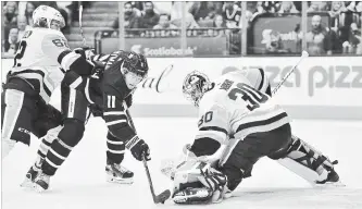  ?? FRANK GUNN THE CANADIAN PRESS ?? Toronto Maple Leafs centre Zach Hyman is stopped by Pittsburgh goaltender Matt Murray Thursday night as Penguins left-winger Carl Hagelin backchecks in the second period in Toronto. The Penguins won, 3-0.