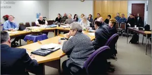  ?? NEWS PHOTO TIM KALINOWSKI ?? MHCBE board of trustees hear the case Tuesday to close Ecole St. Thomas d’Aquin while concerned parents watch the proceeding­s. Board members unanimousl­y decided to go through with the motion to consider closure, and set a date for a special public...