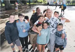  ?? ?? Whitiora School Principal Te Haumoana Biddle wants adequate support for “beautiful kids” whose families are shifting to transition­al housing. He’s pictured with some of his pupils.