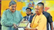  ?? HT PHOTO ?? Chief minister Yogi Adityanath being given a memento at ‘Vikas ▪
Samvad’ programme in Lucknow on Wednesday.