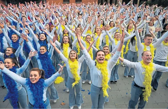  ?? Picture: PA. ?? Dancers in Waterloo, London, attempt to set the Guinness World record for “the world’s largest disco dance” to celebrate the launch of Mamma Mia! Here We Go Again on DVD.