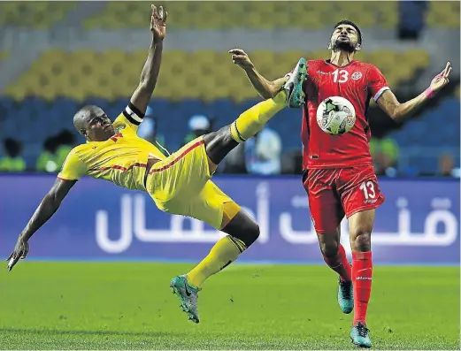  ?? Picture: AFP ?? WORRIED WARRIORS: Zimbabwe’s Willard Katsande challenges his Tunisian counterpar­t Ferjani Sassi. Zimbabwe’s Warriors should have beaten Algeria in their first match, but were held to a draw. They failed to win a single match in the Nations Cup that...