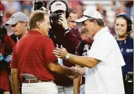  ?? Bob Levey / TNS ?? Alabama coach Nick Saban, left, and Texas A&M coach Jimbo Fisher meet before a game in October.