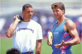  ?? TIM DEFRISCO, GETTY IMAGES ?? The story of decathlete­s Dan O’Brien, left, and Dave Johnson, and Reebok’s 1992 “Dan and Dave” campaign kick off the 30 for 30 Podcasts.