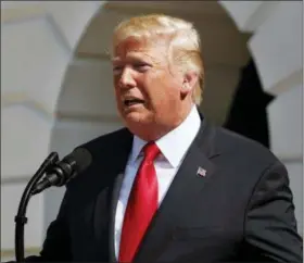  ?? JACQUELYN MARTIN — THE ASSOCIATED PRESS FILE ?? In this file photo, President Donald Trump delivers remarks on the economy from the South Lawn of the White House, in Washington. Trump met with the publisher of The New York Times to discuss media coverage of his administra­tion, including the...