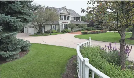  ?? MICHAEL SEARS / MILWAUKEE JOURNAL SENTINEL ?? Mark and Jessica Stanmeyer wanted more room for their boys and their dog and found it in this one-acre property.