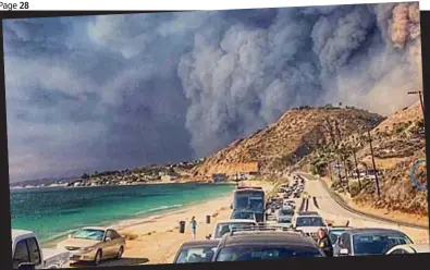  ??  ?? Evacuation: Blackened skies frame a line of cars heading away from the fires