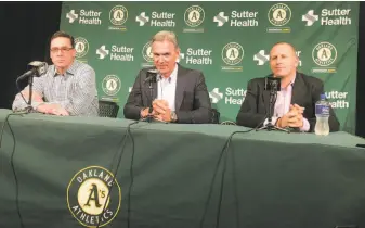 ?? Janie McCauley / Associated Press ?? A’s manager Bob Melvin (left), executive vice president of baseball operations Billy Beane and general manager David Forst at a news conference announcing their contract extensions.
