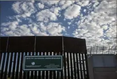  ?? Adriana Zehbrauska­s/The New York Times ?? The Mexico side of the U.S. border wall in Nogales, Mexico. The number of immigrants arrested at the border has nearly doubled since spring, fueled by Mexico’s economic slump and an administra­tion policy that migrants say expels failed border crossers quickly so they can try again.