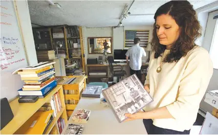  ?? PHOTOS BY RON HARRIS / THE ASSOCIATED PRESS ?? Above: April Ledbetter holds a copy of “Voices of Mississipp­i,” a box set of recordings released by Dust-To-Digital, in Atlanta. Ledbetter and her husband, Lance Ledbetter, operate Dust-to-Digital, a record label that digitizes and re-releases old recordings. Below: A closer look at the “Voices of Mississipp­i” box set cover.