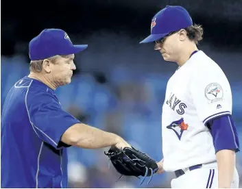  ?? CANADIAN PRESS/FILES ?? This has been an all-too familiar scene for the Blue Jays this year — manager John Gibbons pulling Brett Cecil.