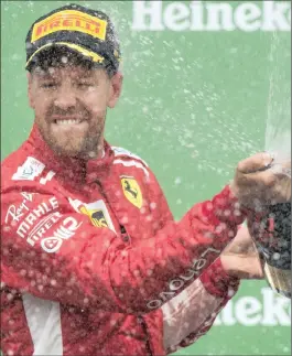  ?? PICTURE: ASSOCIATED PRESS ?? HALF CENTURY: Ferrari’s Sebastian Vettel celebrates after winning the Canadian Grand Prix in Montreal yesterday.