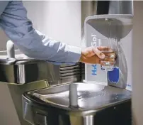  ?? ?? Technology like this touch-free water station or automatic faucets and doors are more important now to many employees who are conscious of avoiding germs.