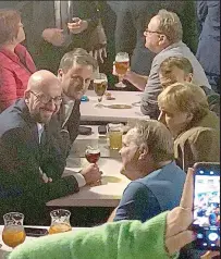  ??  ?? Party time: EU leaders enjoy a beer in Brussels on Wednesday without Mrs May