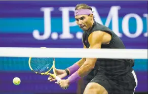  ?? Eduardo Munoz Alvarez / Associated Press ?? Rafael Nadal returns a shot to Matteo Berrettini during the singles semifinals of the U.S. Open last year in New York.