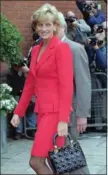  ?? ADRIAN DENNIS, THE ASSOCIATED PRESS ?? The Princess of Wales walks past the press in London on Oct. 8, 1996.