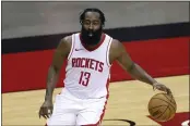  ?? CARMEN MANDATO, POOL — THE ASSOCIATED PRESS, FILE ?? The Rockets’ James Harden controls the ball during a preseason game against the Spurs.