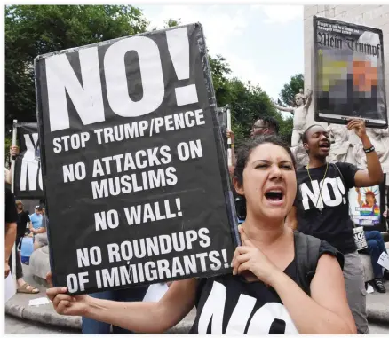  ??  ?? Protesters with “Today Refuse Fascism” hoist signs at Columbus Circle in New York City on Sunday. (AFP)