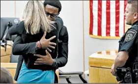  ?? TOM FOX/AP ?? Botham Jean’s brother hugs Amber Guyger, who was convicted in Jean’s killing and sentenced to a decade in prison.