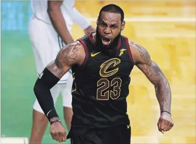  ?? ADAM GLANZMAN GETTY IMAGES ?? LeBron James stole the show Sunday, leading the Cleveland Cavaliers with with 35 points, 15 rebounds and nine assists, and playing all 48 minutes in the Game 7 win over Boston.
