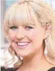  ??  ?? Candice Dixon tries on the $1.6m Calleija Milioni ear cuff at Marina Mirage jewellers.