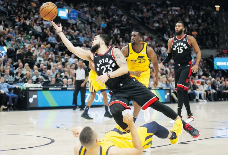  ?? — THE ASSOCIATED PRESS ?? Raptors guard Fred VanVleet lays the ball up as Utah Jazz counterpar­t Dante Exum falls on Monday night in Salt Lake City. Toronto won 124-111.