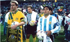  ?? Photograph: Offside/Getty Images ?? Diego Maradona leads out the Argentina team alongside Australia captain Paul Wade in Sydney in 1993.