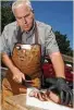  ?? Dave Rossman ?? Mike Albrecht demonstrat­es how to slice a brisket.
